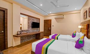 Letto o letti in una camera di Treebo Premium Median Inn