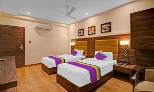 Letto o letti in una camera di Treebo Premium Median Inn