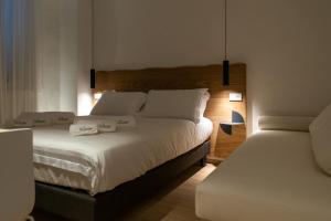Кровать или кровати в номере Civitaloft Luxury Rooms