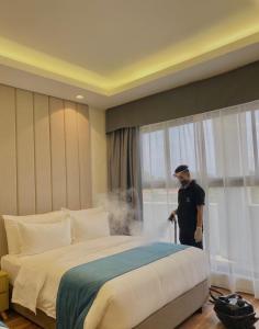 Llit o llits en una habitació de Bravo Tanauan Hotel