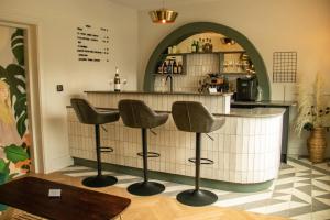 a kitchen with a counter top and a chair at The City Hotel in Chester