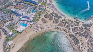 an aerial view of a beach and the ocean at Dome Beach Marina Hotel & Resort in Ayia Napa