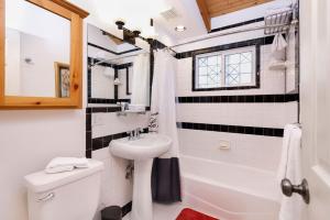 a bathroom with a white sink and a toilet at Moulin Rouge #2055 by Big Bear Vacations in Big Bear Lake +19 photos
