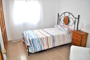 A bed or beds in a room at Miguel Hernandez, centro, 3 dormitorios, by Bookindenia