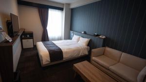 Voodi või voodid majutusasutuse LC Goryokaku Hotel toas