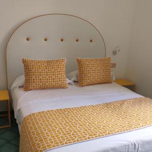Cama o camas de una habitación en Albergo S. Andrea