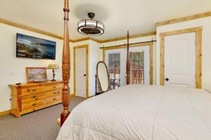 a bedroom with a bed and a dresser and a mirror at Happy Bear #2053 by Big Bear Vacations in Big Bear Lake