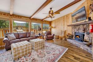 a living room with a couch and a fireplace at Happy Bear #2053 by Big Bear Vacations in Big Bear Lake