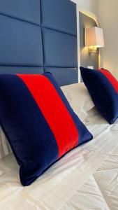 Letto o letti in una camera di Hotel Rombino