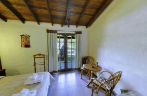 Ένα ή περισσότερα κρεβάτια σε δωμάτιο στο Hosteria Rural Piedra y Camino +37 φωτογραφίες