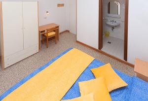 Giường trong phòng chung tại Hotel Amalfi & Dépendance