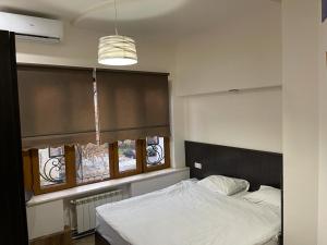 Ένα ή περισσότερα κρεβάτια σε δωμάτιο στο Yerevan Hostel