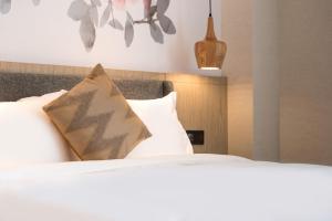 Letto o letti in una camera di Paco Hotel Canton Tower Pazhou