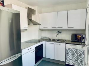Dapur atau dapur kecil di Hauzify I Apartament Fortuny
