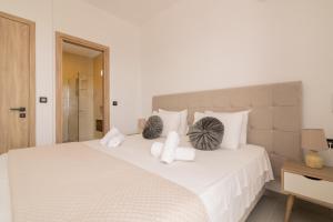 A bed or beds in a room at Queen of Zakynthos Luxury Villas