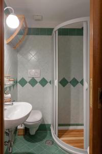 a bathroom with a shower and a toilet and a sink at Agora Apartments -Friend's House Sorrento in Sorrento +12 photos