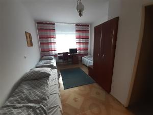 Posteľ alebo postele v izbe v ubytovaní OŚRODEK WYPOCZYNKOWY MAZOWSZE W KARPACZ