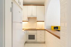 A kitchen or kitchenette at LU&CIA THYSSEN CITY CENTER