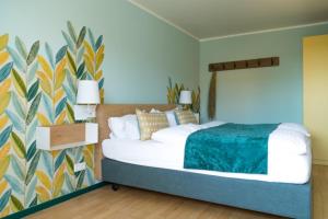 מיטה או מיטות בחדר ב-Hotel Viva Sky