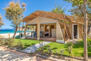a villa with a view of the beach at Armenistis Mediterranean Camping Village in Sarti