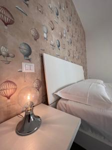 Postel nebo postele na pokoji v ubytování Il Giramondo Suite&Room self check-in