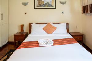 Postel nebo postele na pokoji v ubytování dreamplace Gigiri + 37 fotografií