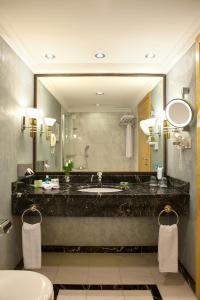 
a bathroom with two sinks and a mirror at InterContinental Istanbul, an IHG Hotel in Istanbul

