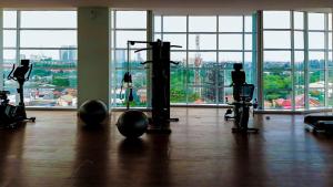 a gym with a view of a city at Ventura Room at TreePark City in Kebun Nanas