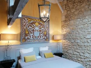 Säng eller sängar i ett rum på Chambres d'hôtes Domaine de Ginouilhac