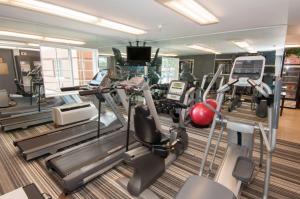 a gym with treadmills and cardio equipment in a building at Sonesta Simply Suites Anaheim in Anaheim