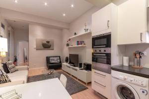 a kitchen and living room with a washer and dryer at Bilbao Arte II by Aston Rentals in Bilbao