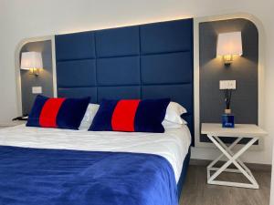 Letto o letti in una camera di Hotel Rombino