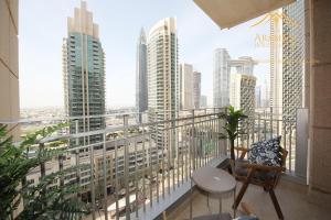 a balcony with a view of a city skyline at New Arabian Stand Point Downtown Dubai in Dubai