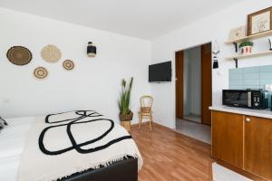 Kuchyňa alebo kuchynka v ubytovaní Sleepway Apartments -Boho Chic