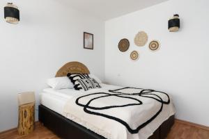 Posteľ alebo postele v izbe v ubytovaní Sleepway Apartments -Boho Chic