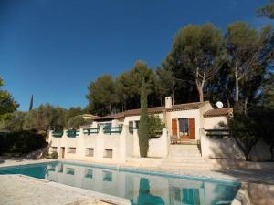 a house with a swimming pool in front of it at Villa Sampa in Le Beausset