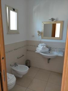Ванная комната в Villaggio Hotel Agrumeto