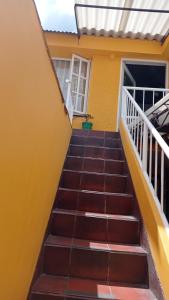 a staircase leading up to a house at Habitación 5 minutos aeropuerto in Bogotá