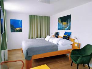 Postel nebo postele na pokoji v ubytování Hotel Garni Villa Areka