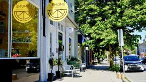 a store with signs on the side of a street at Flats South in Wellington