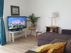 A television and/or entertainment centre at Apartment Blue Dream