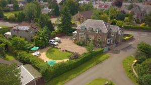 an aerial view of a large house with a driveway at Galvelbeg House self catering apartment in Crieff