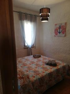 Postel nebo postele na pokoji v ubytování house scoglio di scibiliana
