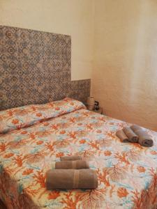 Postel nebo postele na pokoji v ubytování house scoglio di scibiliana