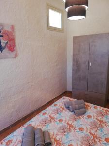 Postel nebo postele na pokoji v ubytování house scoglio di scibiliana
