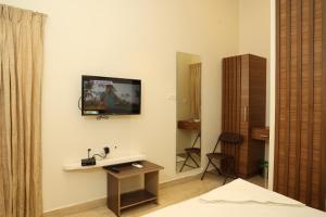 TV a/nebo společenská místnost v ubytování Hotel Amoha
