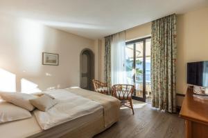 Ein Bett oder Betten in einem Zimmer der Unterkunft Boutique Hotel La Rocca