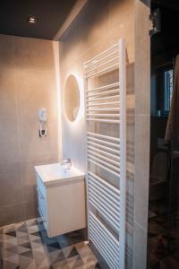 a bathroom with a sink and a mirror at Hotel Carpe Diem in Mostar