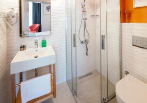 a bathroom with a sink and a shower at Meraki Bozcaada in Bozcaada