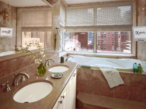 a bathroom with a sink and a window at The Kimberly Hotel in New York